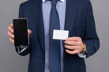 Man use online money on phone. Show business card. Credit or debit card. Man pay at online banking. Shopping app. Cyber Monday. Businessman use smartphone for fast payment