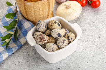 Raw quail eggs in the bowl