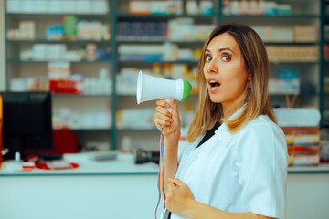 Pharmacist Holding a Loudspeaker Announcing Promotional Prices. Cheerful marketing specialist...