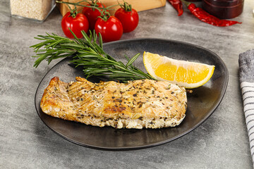 Baked salmon fish served rosemary