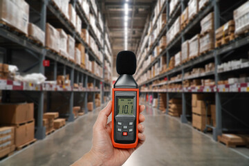 Measuring noise in warehouses with a sound level meter.Noise pollution prevention concept