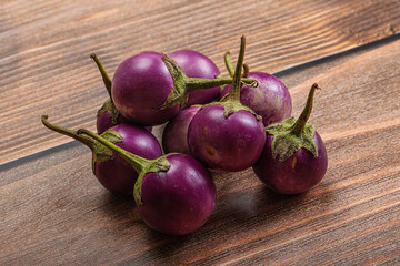 Raw small purple asian baby eggplant