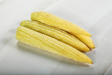 Raw sweet baby corn heap