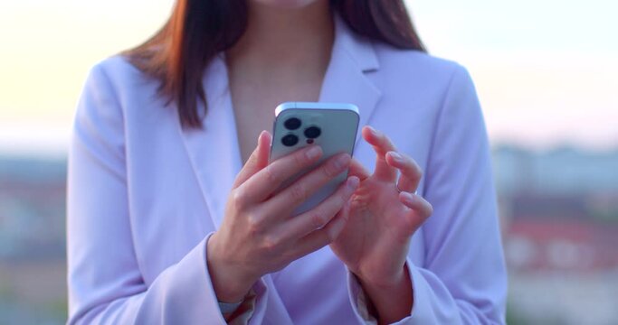 Smartphones. No face woman using smartphone. Phone in hands highlighting technology and modern lifestyle. Connectivity, efficiency, adaptability humans in digital era. Phone in female hands outdoor
