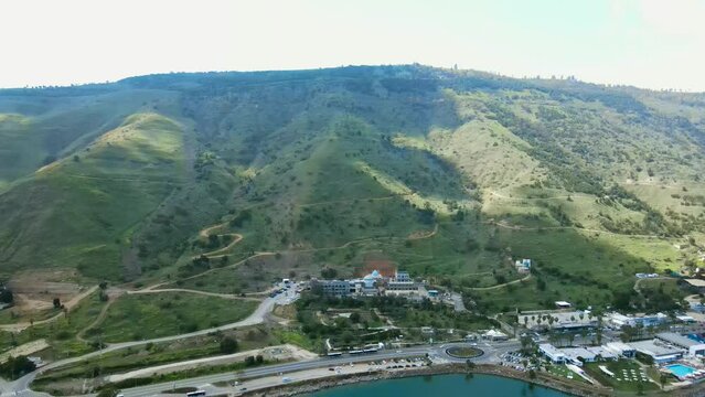 mountain at the foot of the Sea of Galilee.
The mountain is shadowed by clouds. Dolly out shot.
Tomb of Rabbi Meir Baal Hans in the background.
Spring season.