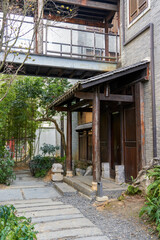 Wooden gate and wooden roof of traditional Chinese building