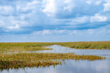 Cloudy skies above the open Florida Everglades grasslands