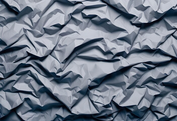 Obraz premium A close-up photo of crumpled gray paper