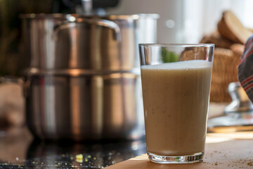 View to a cooking pot with a glass of butter milk which I used as one of the ingredients for my baking session