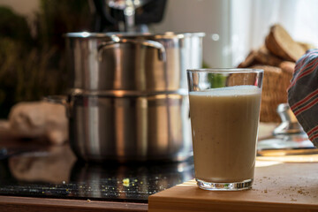 View to a cooking pot with a glass of butter milk which I used as one of the ingredients for my baking session