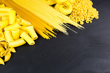 pasta on black wooden background
