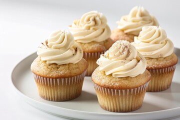 Apple Cupcakes with Creamy Frosting and a Sprinkle of Cinnamon