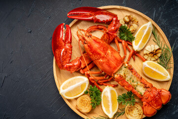 Grilled Lobster with Cheese in black wood plate on wooden background.