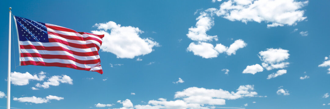 National flag day banner with United States of America flag on blue sky with clouds, copy space