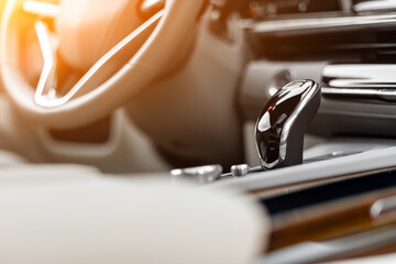   Close up of the manual gearbox transmission handle. Accelerator handle and buttons in a new car. .