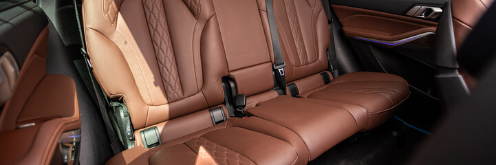 Close-up     brown   leather   passenger seats. Luxury car interior