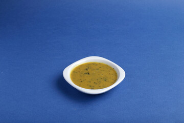 Set of different tasty sauces in bowl with sauce isolated on blue background top view.