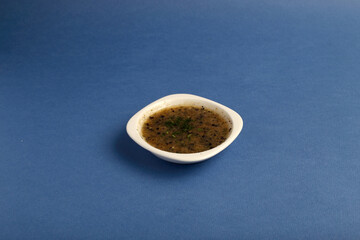 Set of different tasty sauces in bowl with sauce isolated on blue background top view.