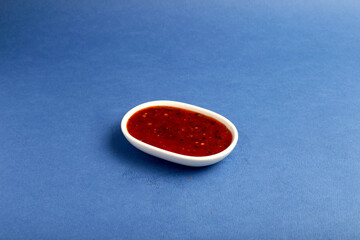 Set of different tasty sauces in bowl with sauce isolated on blue background top view.