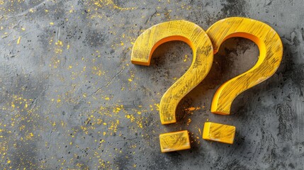  A yellow question mark atop a cement floor, beside a puddle of dried yellow paint