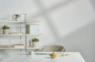 White room table and bookshelf background, decorative wall, working desk with book and chair style.