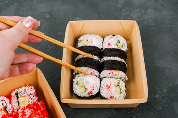Sushi in Takeaway Boxes. Sushi Rolls in eco-friendly boxes.