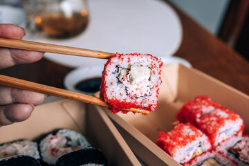 Sushi in Takeaway Boxes. Sushi Rolls in eco-friendly boxes.
