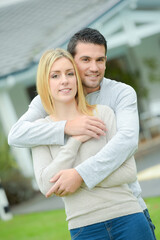 Obraz premium couple in front of a house
