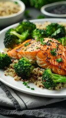 A plate of food with salmon and broccoli on it