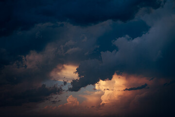 Dark blue and orange cloudy sky