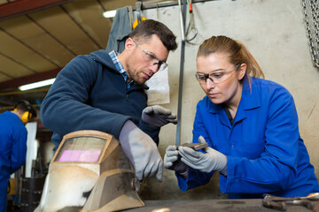 portrait of female apprentice welder