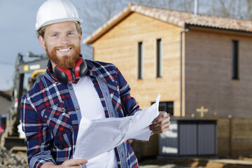 happy male worker making a work plan