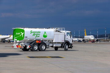 Sustainable Aviation Fuel (SAF) truck is waiting for aircraft refueling operation at the airport.