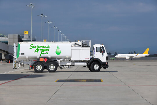 Sustainable Aviation Fuel (SAF) truck is waiting for aircraft refueling operation at the airport.