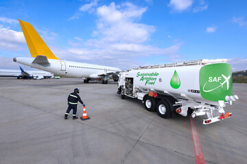 Sustainable Aviation Fuel (SAF) truck is waiting for aircraft refueling operation at the airport.