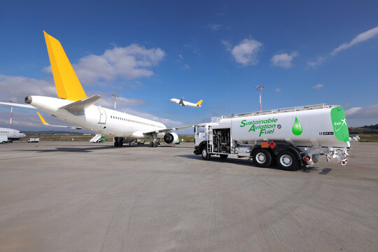 Sustainable Aviation Fuel (SAF) truck is waiting for aircraft refueling operation at the airport.