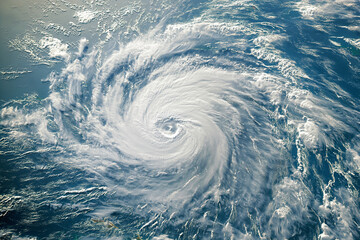 Satellite image of a massive hurricane approaching a densely populated coast 