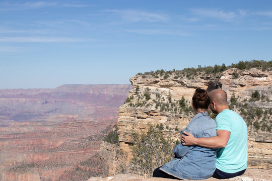 ouple embracing at scenic Grand Canyon viewpoint