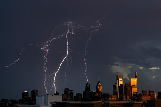 Giant lightning strike behind the Philly skyline catching the la