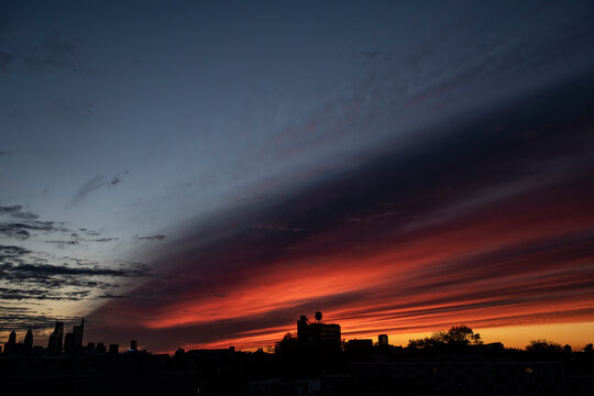 Brilliant sunrise paints a colorful sky over Philly skyline