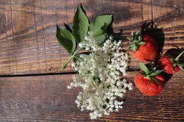 Strawberries on rustic wooden table, top view