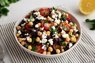 Homemade Chickpea And Black Bean Salad in a Bowl, side view.