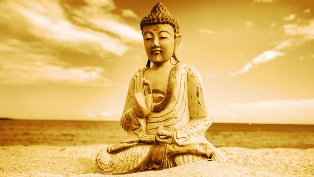 A buddha statue on a beach