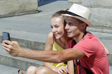 young couple tourist taking selfie