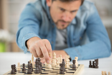 a young man playing chess