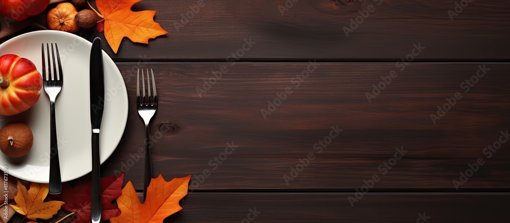 Poster a festive autumn table with cutlery and vibrant fall leaves perfect for thanksgiving copy space imag