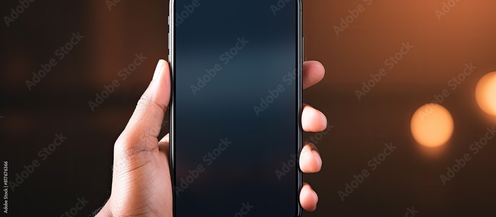 Poster A person holding a smartphone with a display that can be replaced with a different image using a copy space image