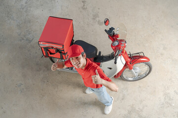 Delivery man with motorcycle giving thumb up