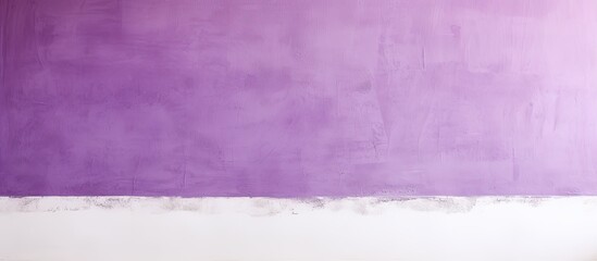 A horizontal picture of a purple and white stucco wall with a concrete texture in the background creates a copy space image