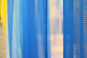 Colorful transparent fabric curtain background.